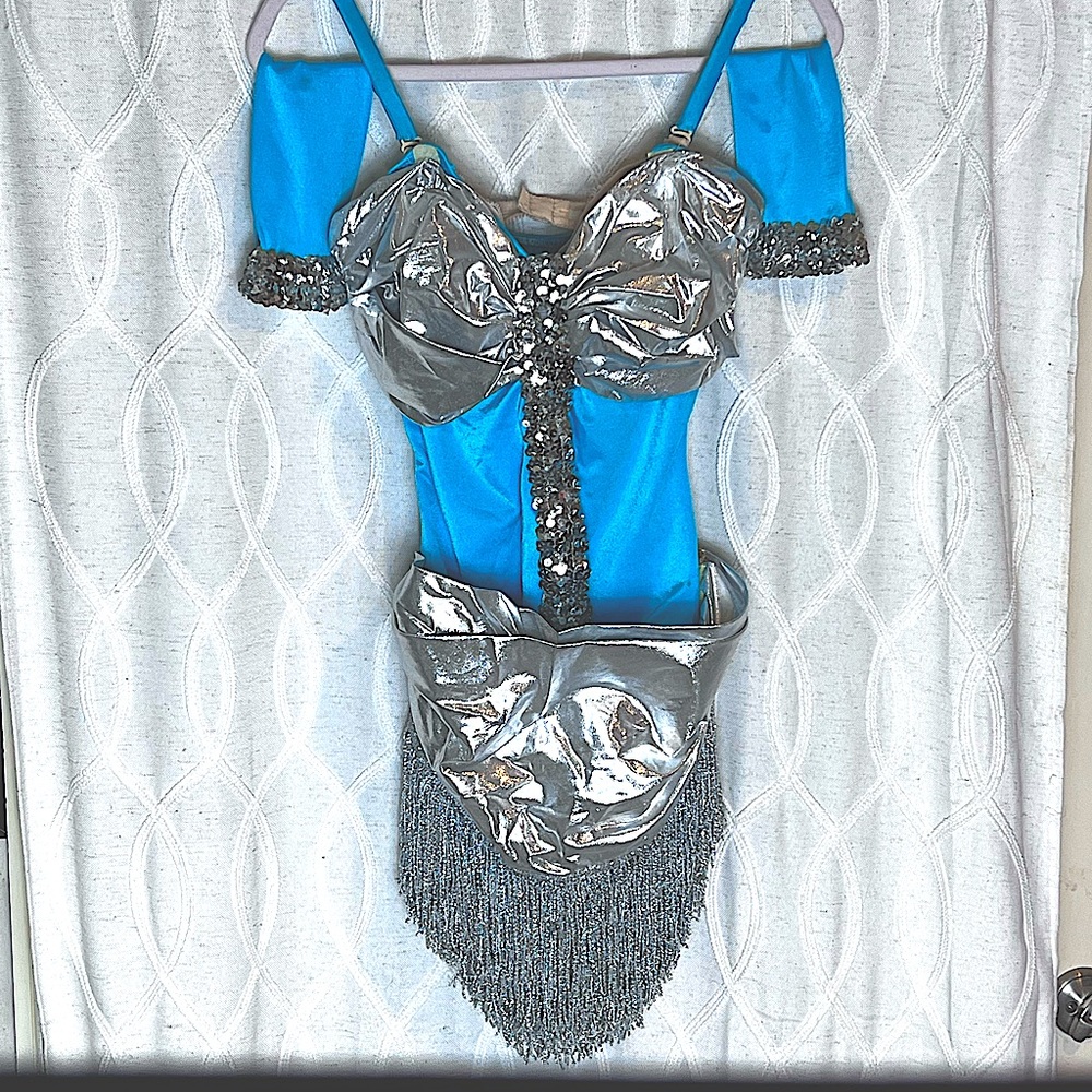 COSTUME: Turquoise stretch fabric & Silver Sequins & Silver Sash & Fringe.